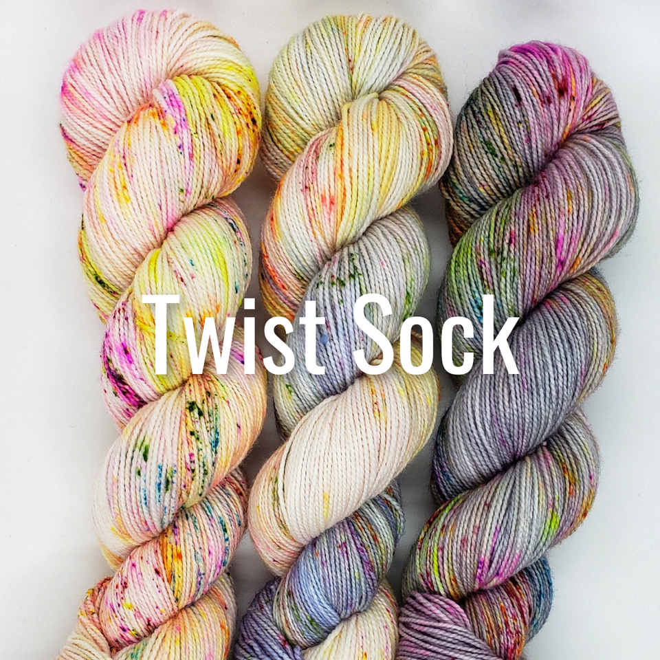 Twist Sock. Image of 3 colorful skeins of yarn